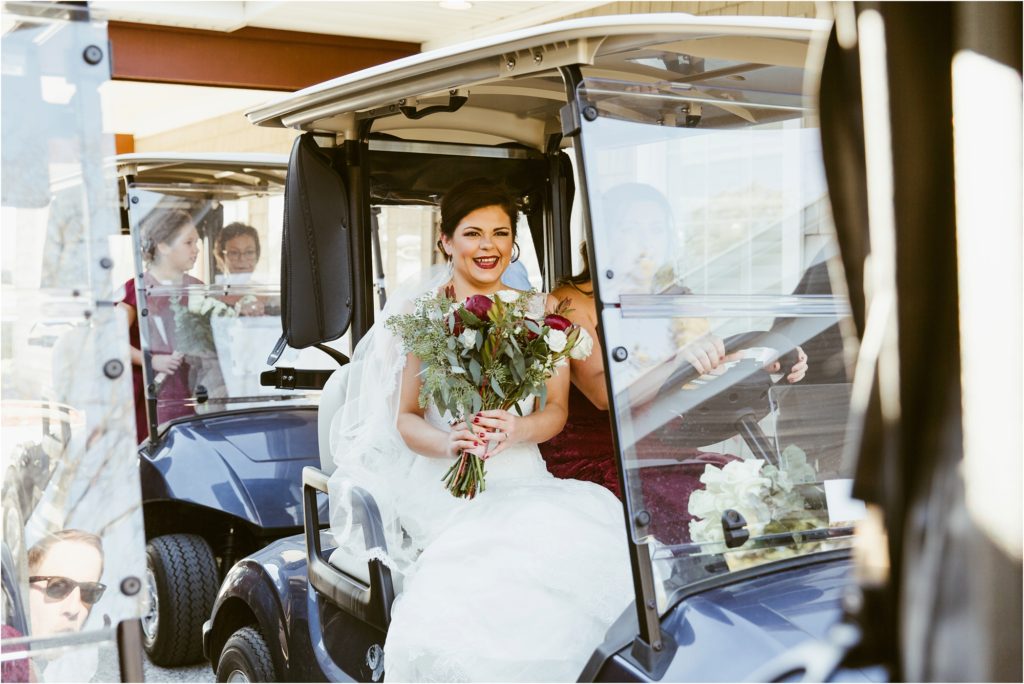 Bride riding in golf cart to go take portraits with groom in Nashville, TN