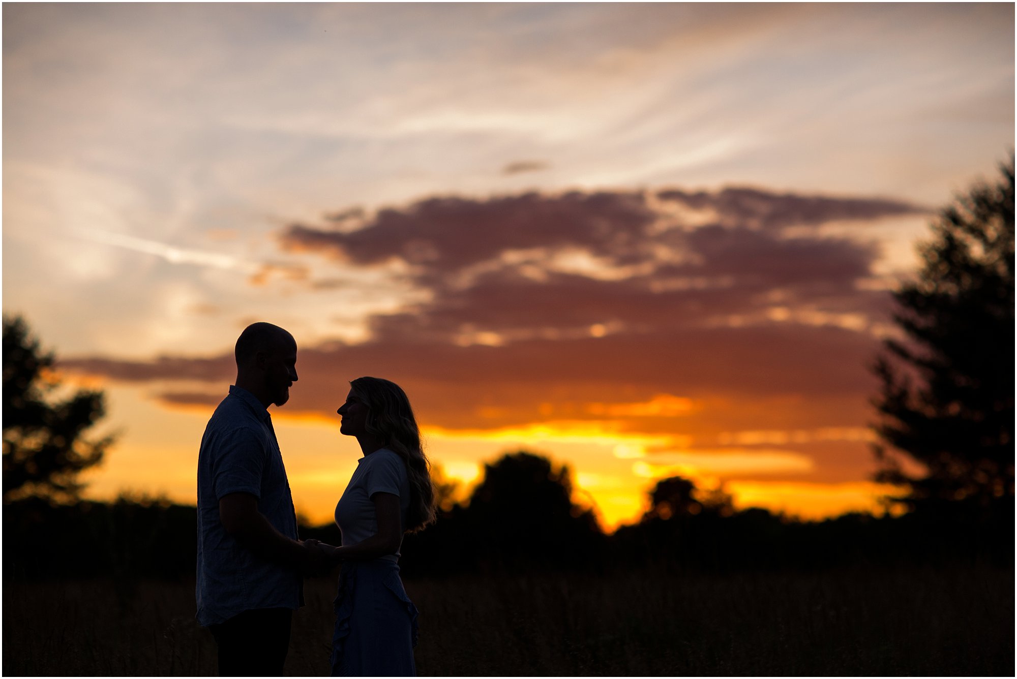 Silhouetted image of couple with beautiful Tennessee sunset behind them