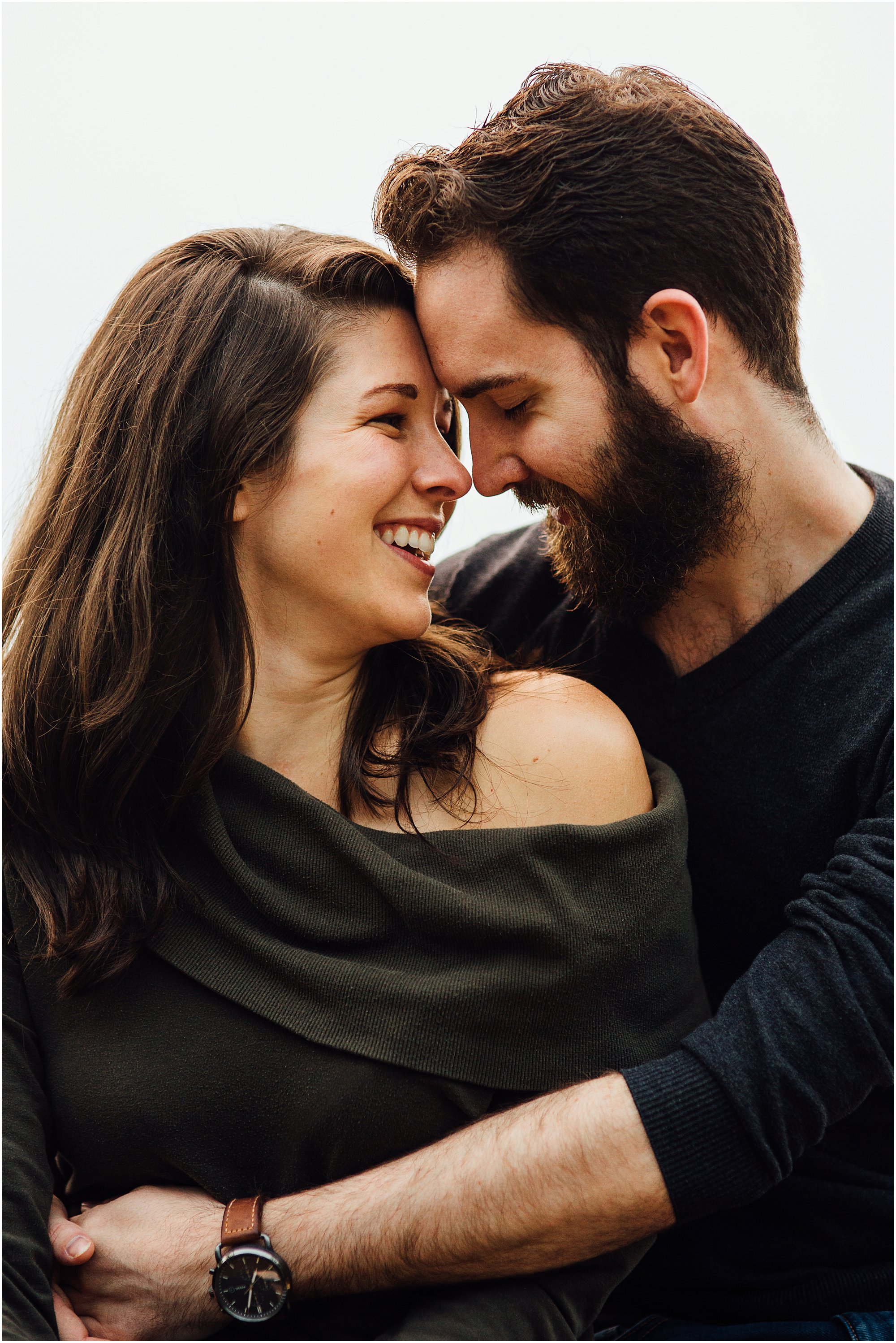 Couple hugging and touching foreheads during Nashville, Tennessee Engagement Session.