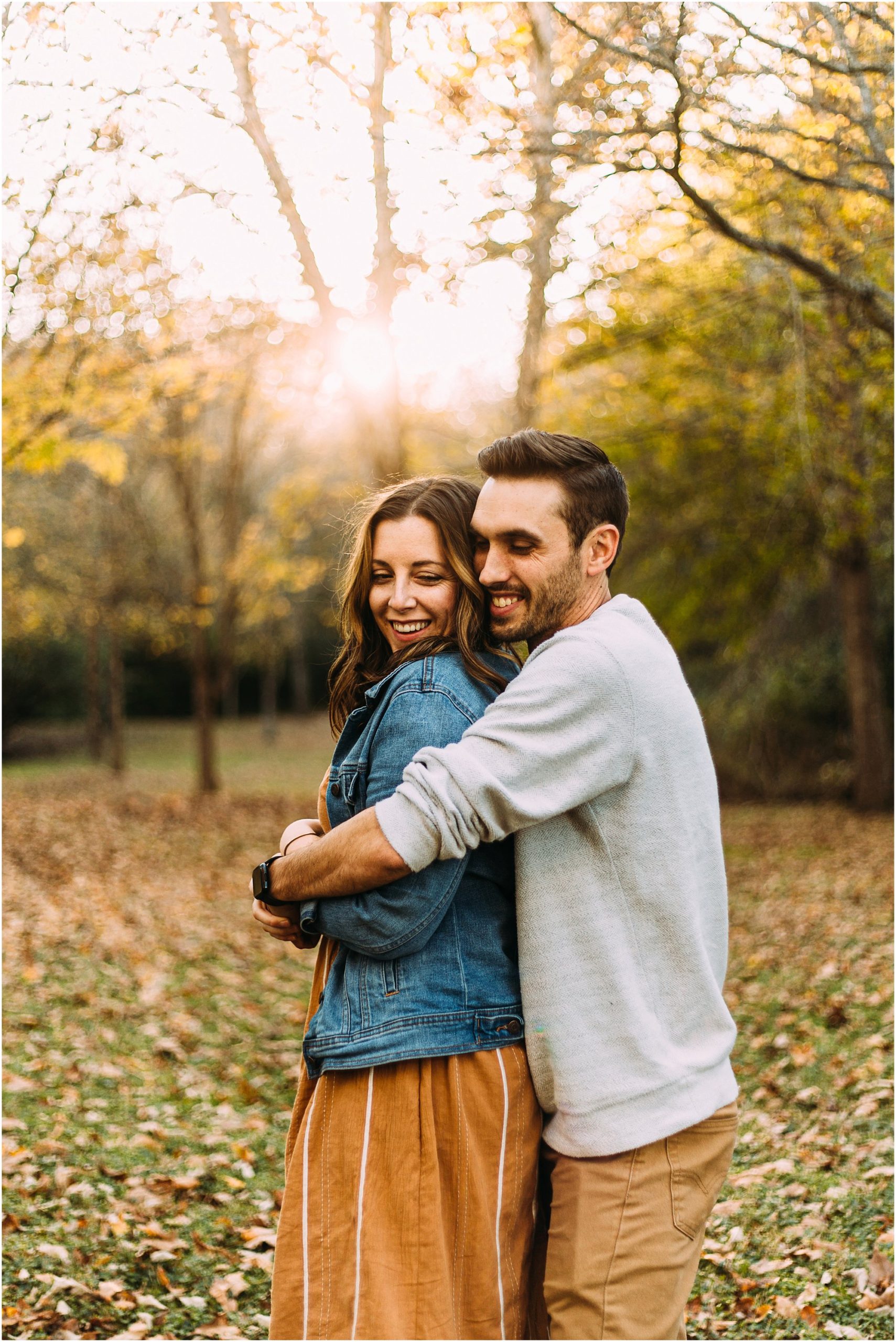 Nashville couple embracing in the autumn leaves