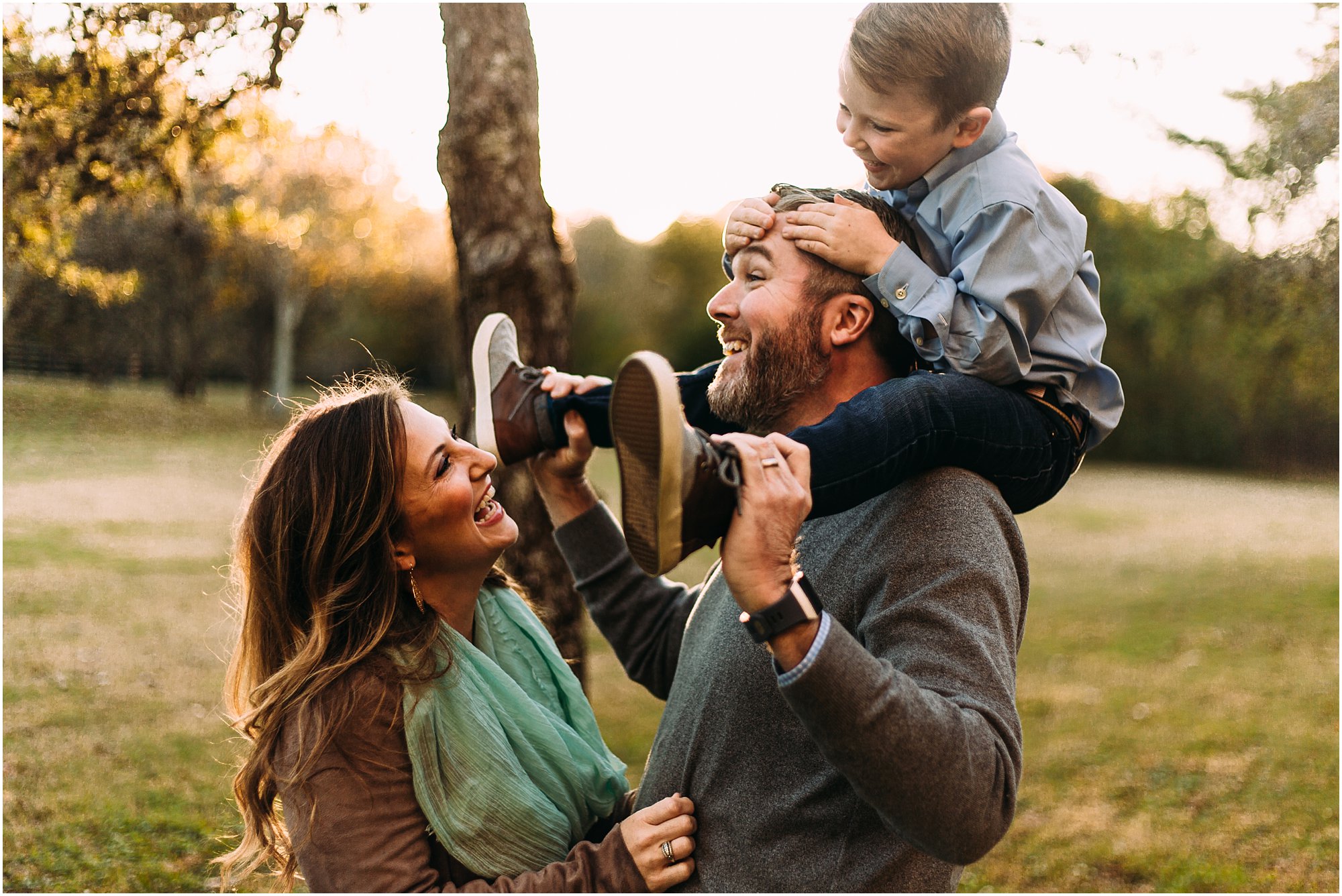 Family laughing and being silly together during their fall mini session in Nashville, Tennessee