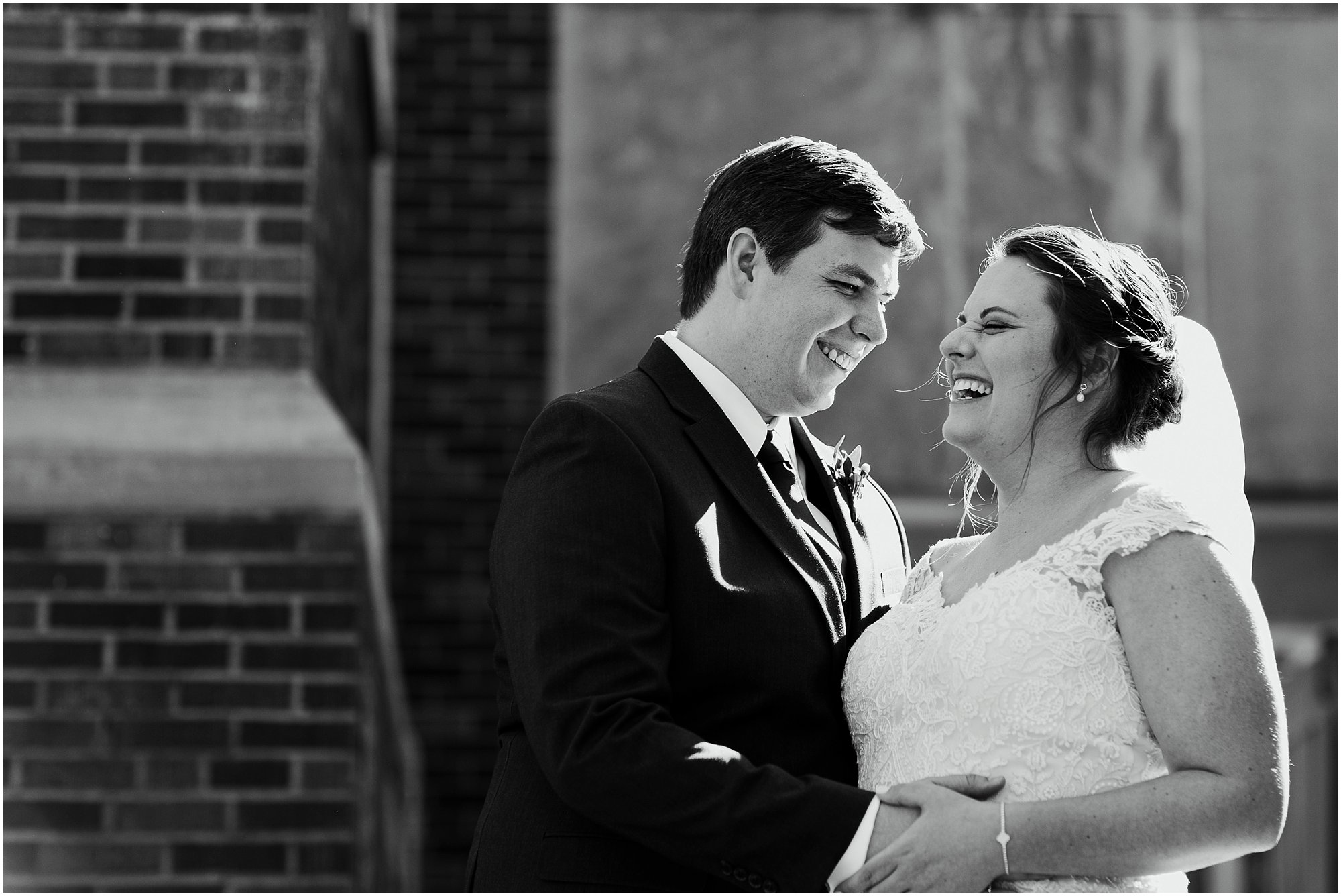 Bride and groom laughing together before their ceremony