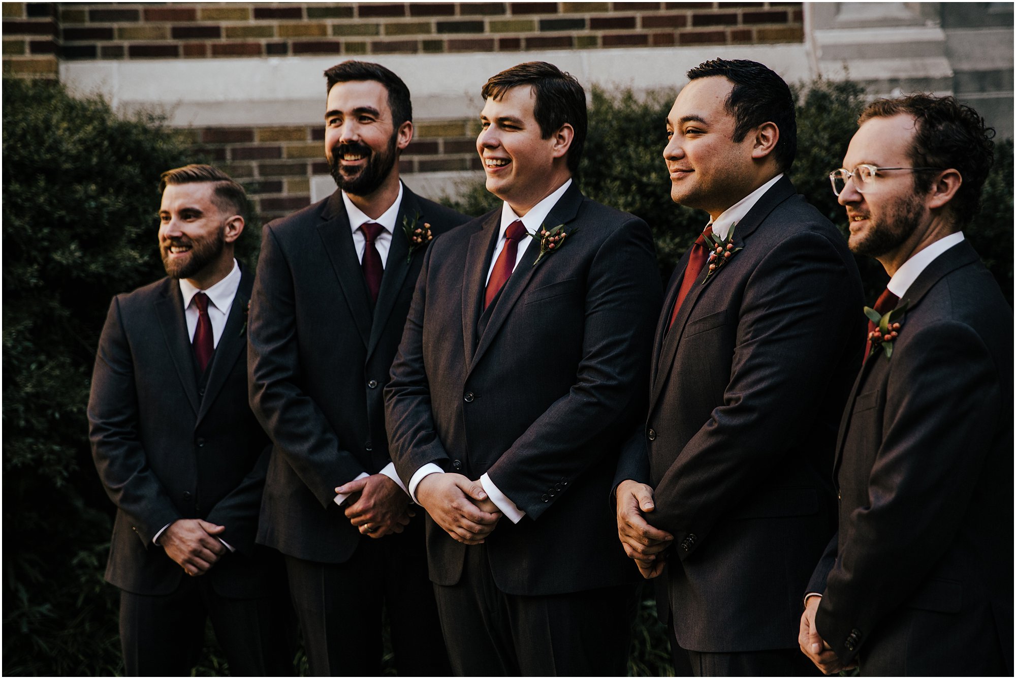Groom and groomsmen laughing and smiling