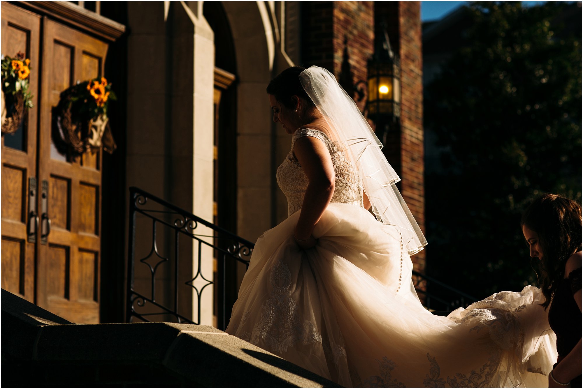 Bride walking up the steps into St. Luke's church