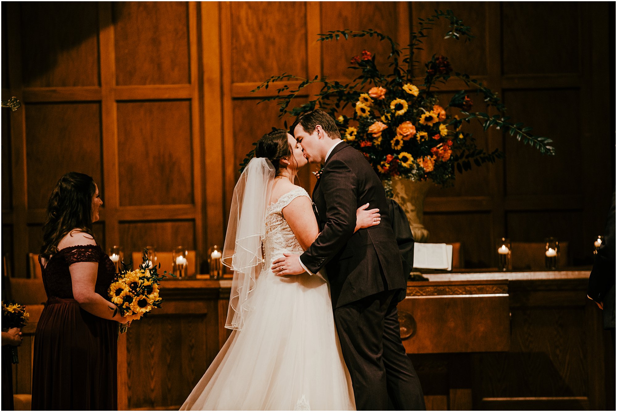 Couple being pronounced as husband and wife and going in for a kiss