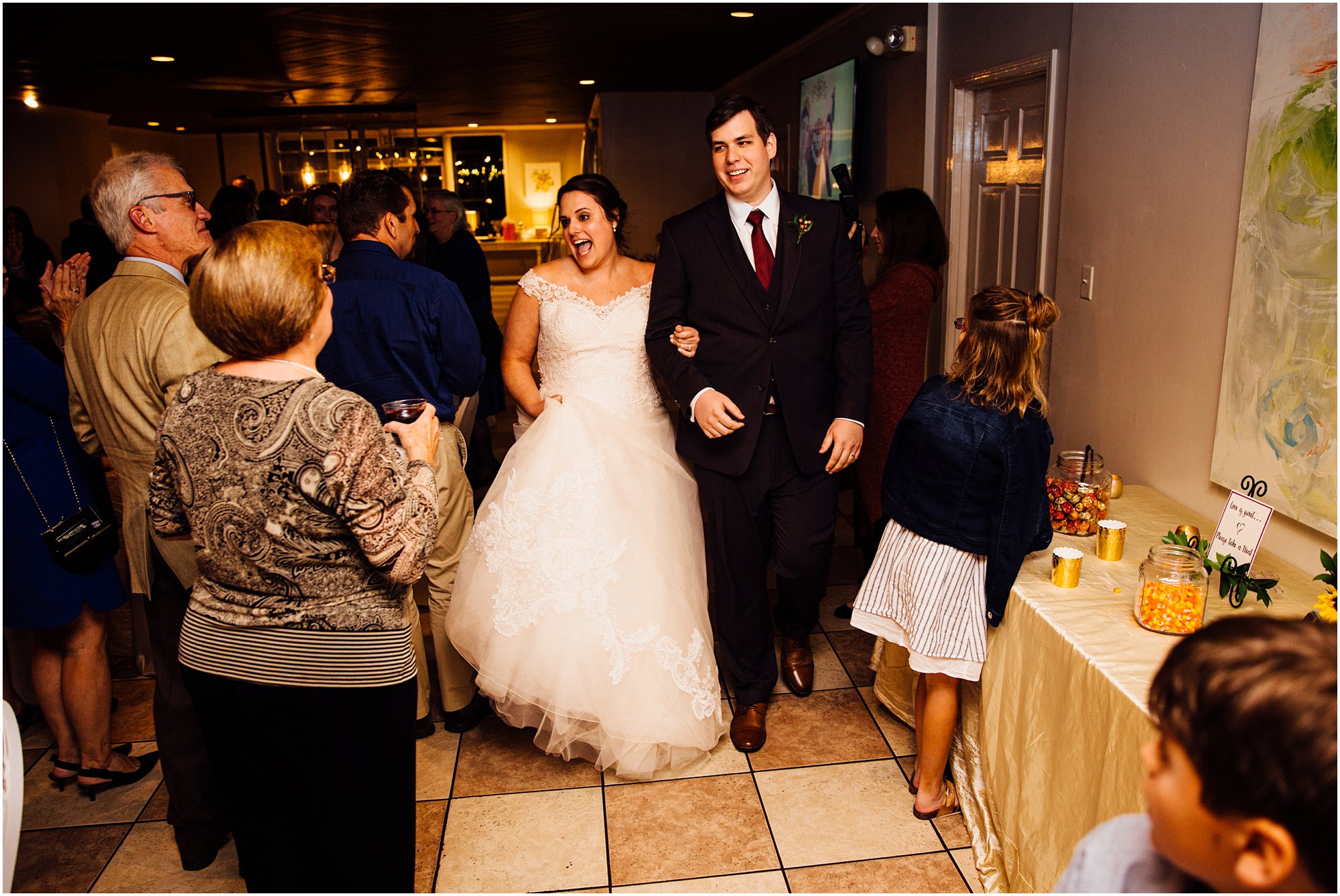Lauren and Kevin entering their reception at Club Windward in Memphis, TN