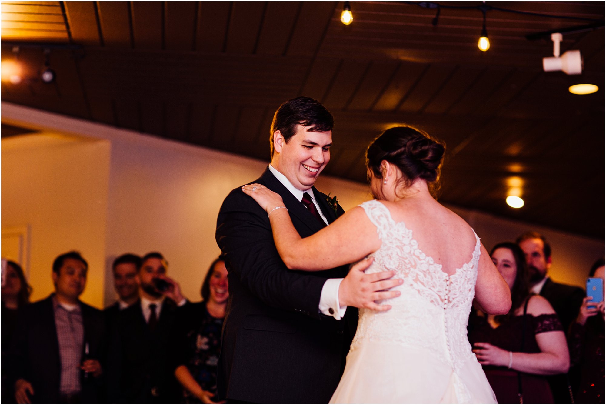 Bride and groom dancing together at Club Windward in Memphis during their first dance
