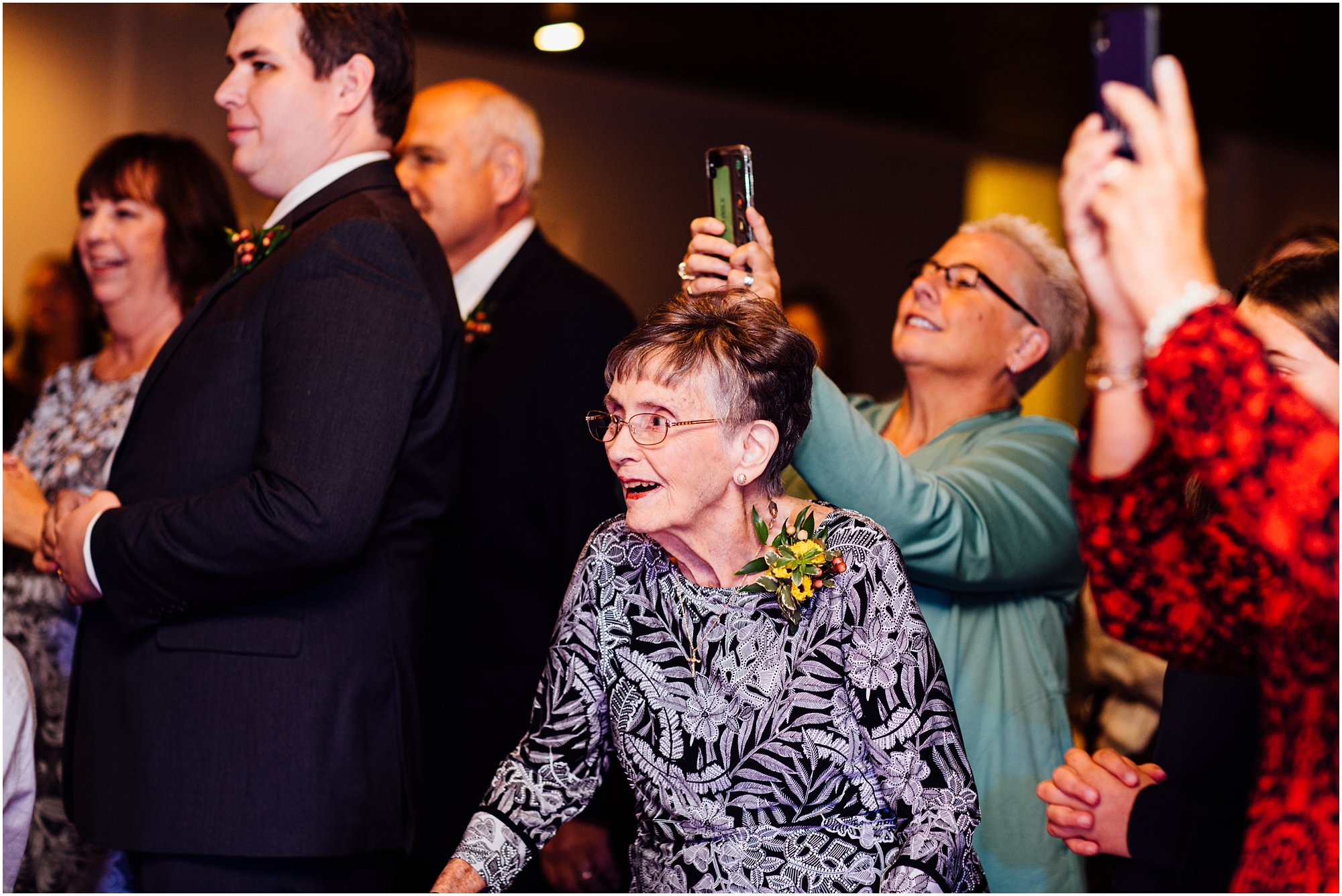 Bride's grandmother happily watching the first dance