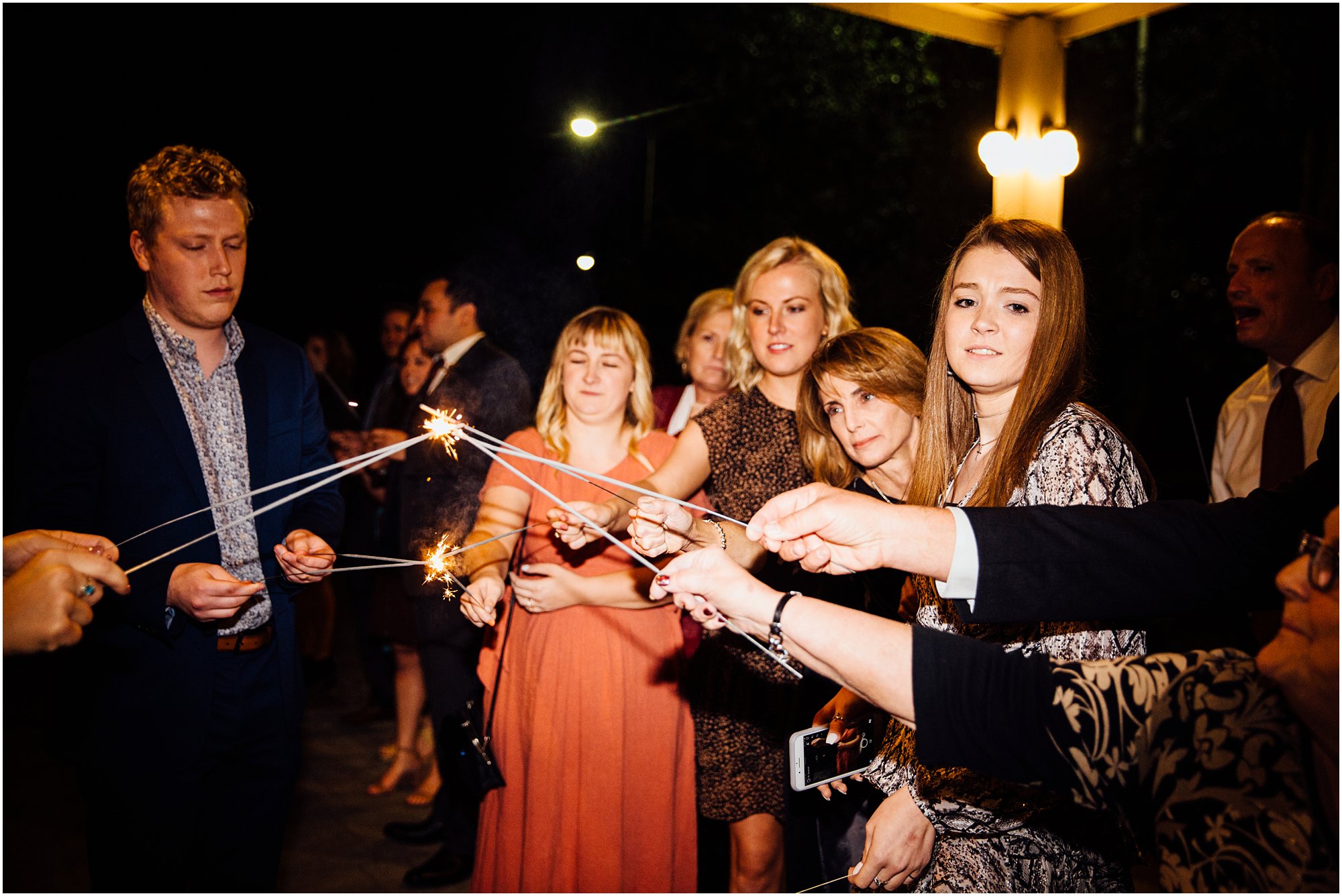 Wedding guests lighting their sparklers preparing for exit in Memphis, TN